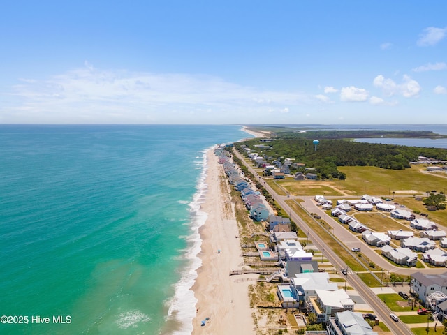 aerial view featuring a water view and a beach view