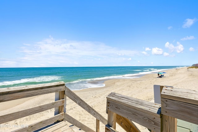 property view of water featuring a beach view