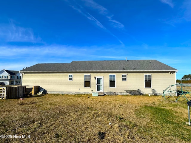 back of house with a yard