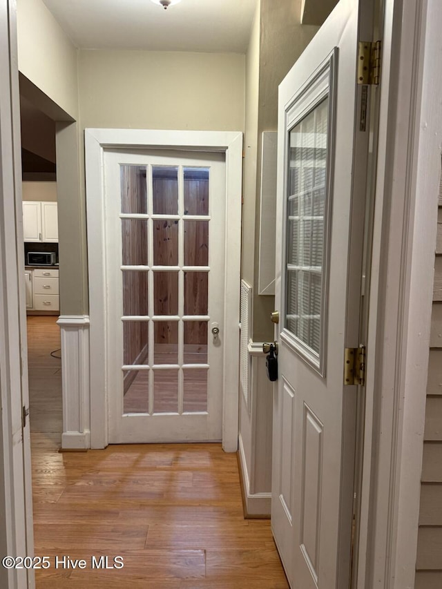 entryway with light hardwood / wood-style flooring