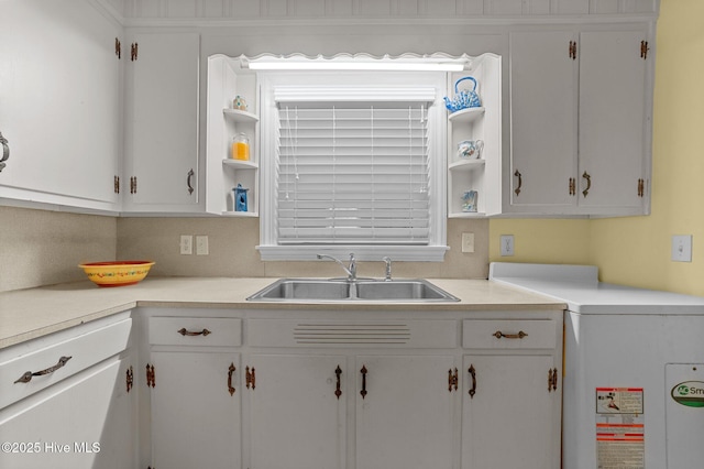 kitchen featuring white cabinetry, open shelves, and a sink