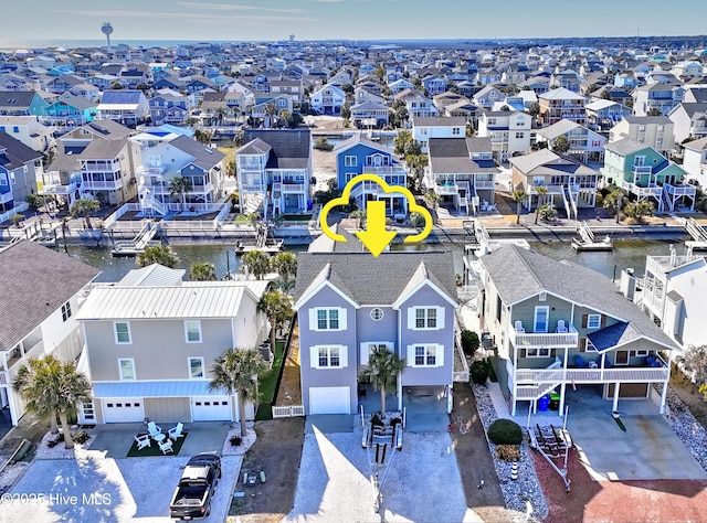 aerial view featuring a residential view and a water view