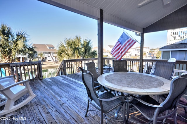 wooden terrace with outdoor dining area