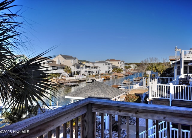 exterior space featuring a water view and a residential view