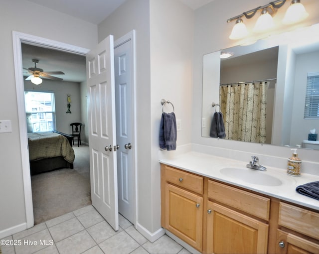 ensuite bathroom featuring ceiling fan, tile patterned flooring, vanity, and connected bathroom