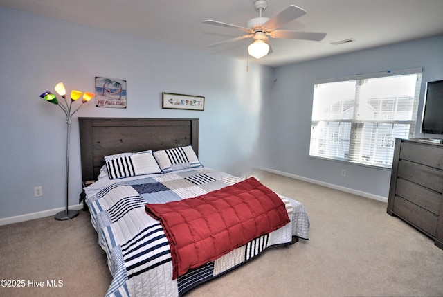 bedroom with carpet flooring, visible vents, and baseboards