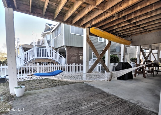 deck with stairs, a patio area, area for grilling, and fence