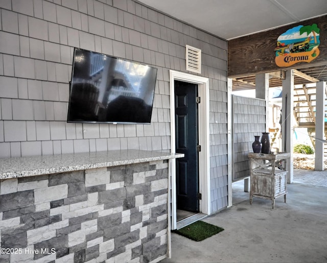 doorway to property with visible vents