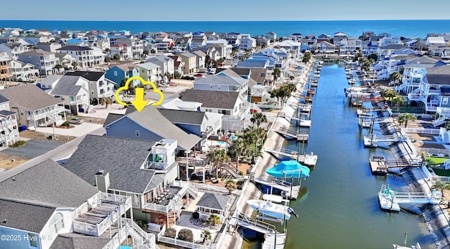 bird's eye view with a water view and a residential view