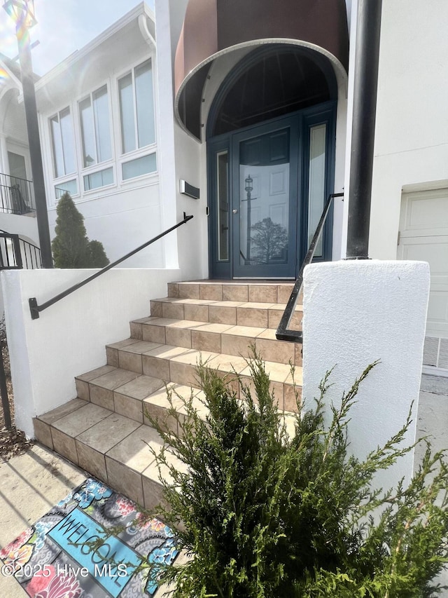 doorway to property with stucco siding