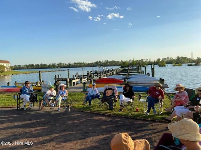 view of dock featuring boat lift and a water view