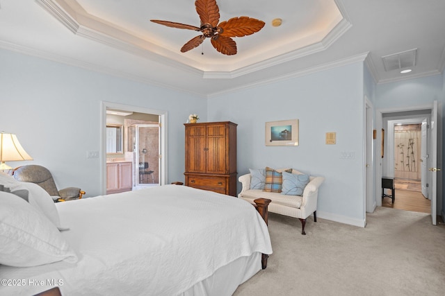 bedroom featuring a tray ceiling, light carpet, crown molding, and visible vents