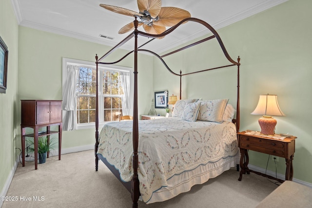 bedroom featuring light colored carpet, a ceiling fan, baseboards, visible vents, and ornamental molding