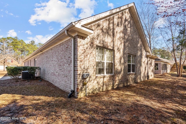 view of property exterior featuring brick siding