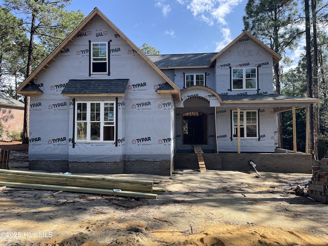 property in mid-construction featuring covered porch