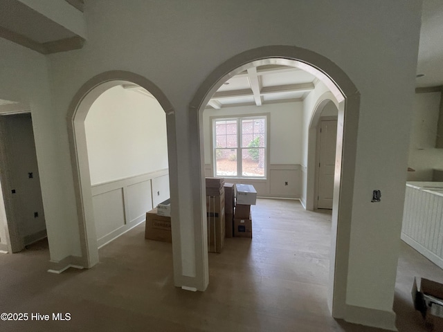 241 Juniper Creek Blvd, Pinehurst, NC 28374 - corridor with arched walkways, coffered ceiling, beamed ceiling, a decorative wall, and wainscoting