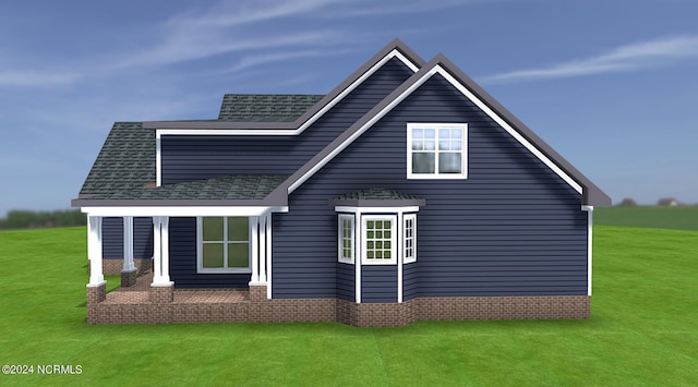 rear view of property with a yard and a shingled roof