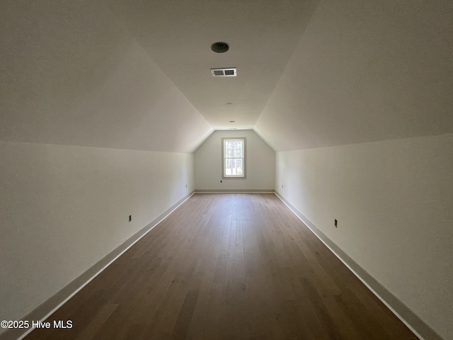241 Juniper Creek Blvd, Pinehurst, NC 28374 - additional living space featuring vaulted ceiling, baseboards, and wood finished floors