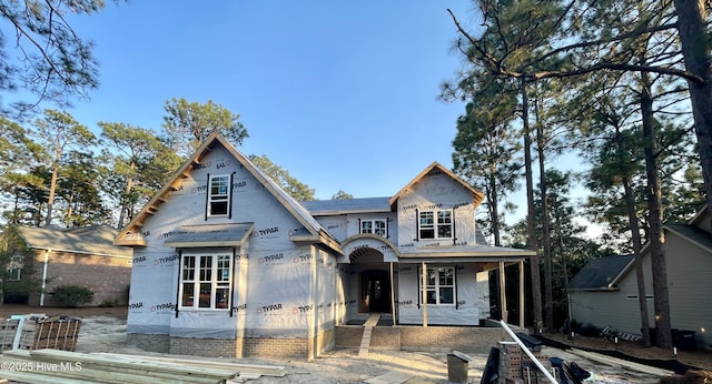 property under construction featuring covered porch