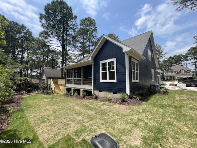 241 Juniper Creek Blvd, Pinehurst, NC 28374 - view of side of home with crawl space, a sunroom, a lawn, and central AC unit