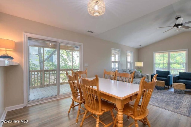 106 NE 62nd St, Oak Island, NC 28465 - dining room with wood finished floors, a ceiling fan, lofted ceiling, and baseboards