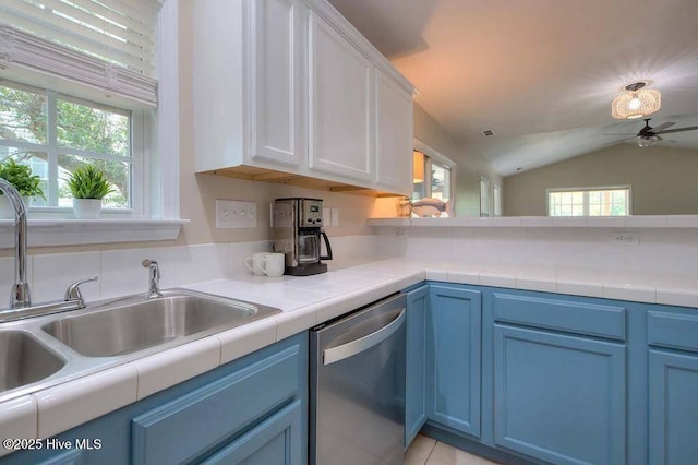 106 NE 62nd St, Oak Island, NC 28465 - kitchen with dishwasher, a sink, healthy amount of natural light, ceiling fan, and lofted ceiling
