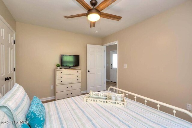 bedroom featuring baseboards, a closet, visible vents, and light wood-style floors