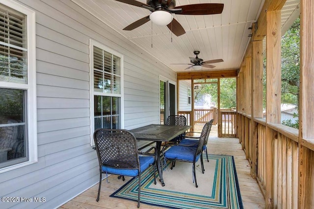 106 NE 62nd St, Oak Island, NC 28465 - sunroom / solarium featuring ceiling fan and outdoor dining area