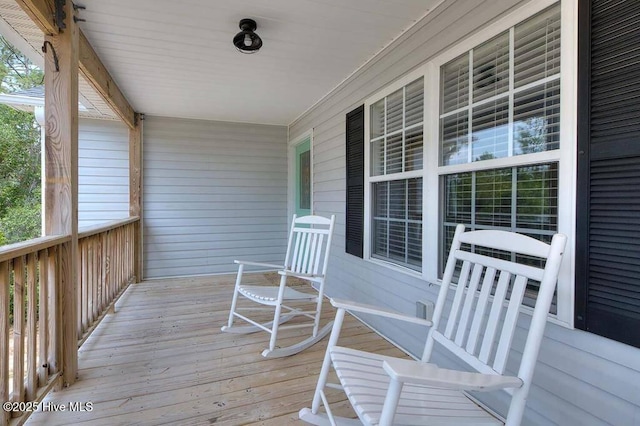 wooden terrace featuring a porch