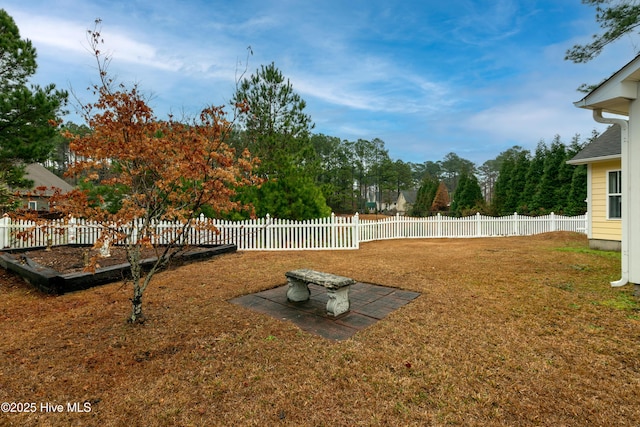 125 Neeley Ln, New Bern, NC 28560 - rear view of property featuring a fenced backyard, a shingled roof, and a yard