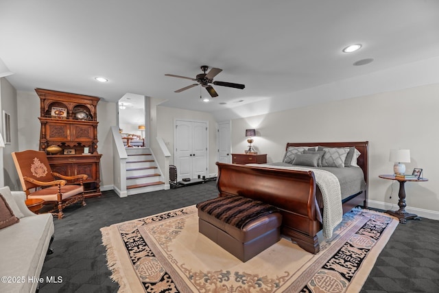 carpeted bedroom featuring ceiling fan