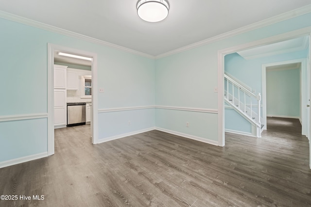 unfurnished room with hardwood / wood-style flooring and crown molding