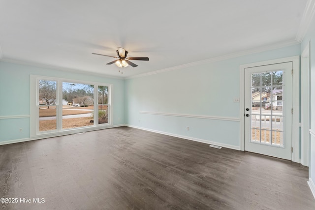 empty room with crown molding, ceiling fan, and dark hardwood / wood-style floors