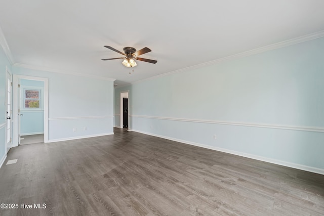 spare room featuring ceiling fan, ornamental molding, and wood-type flooring