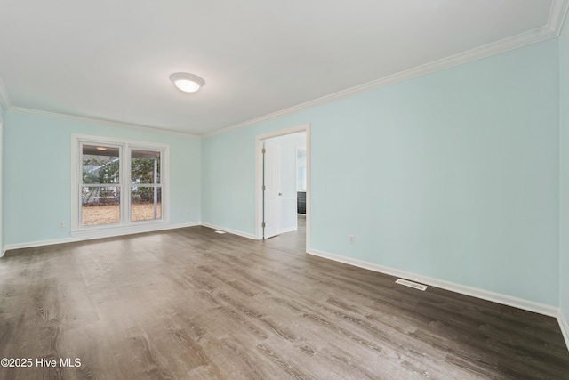 unfurnished room featuring wood-type flooring and crown molding