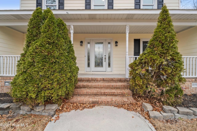 entrance to property with a porch