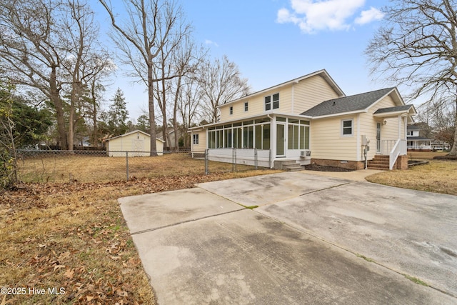 back of property featuring a sunroom