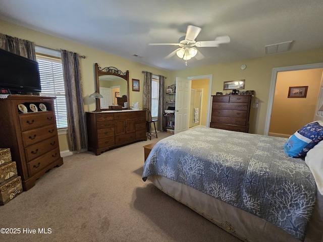 carpeted bedroom featuring ceiling fan