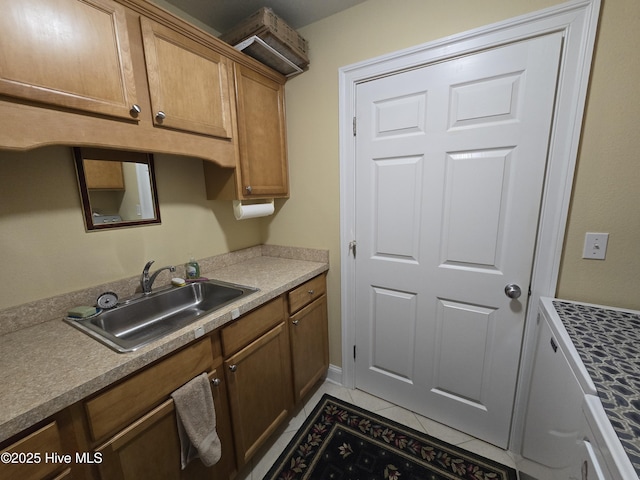 kitchen featuring light tile patterned flooring and sink