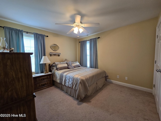 bedroom featuring ceiling fan and light colored carpet