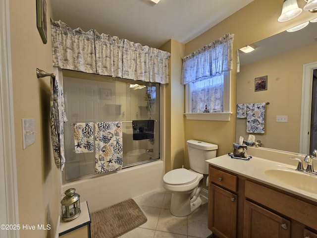 full bathroom featuring vanity, tile patterned floors, enclosed tub / shower combo, and toilet