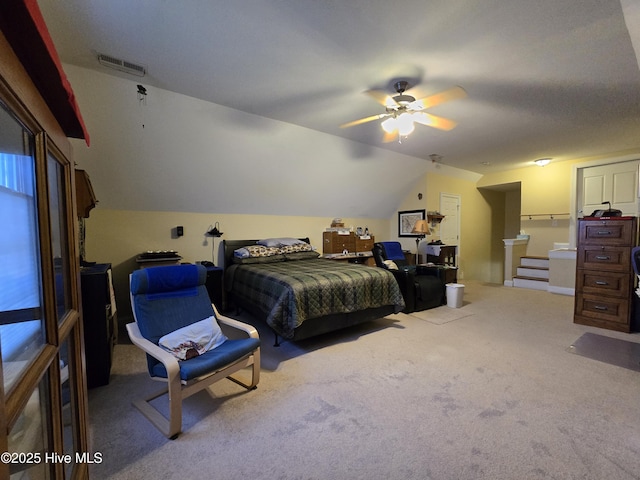 bedroom featuring lofted ceiling, light colored carpet, and ceiling fan