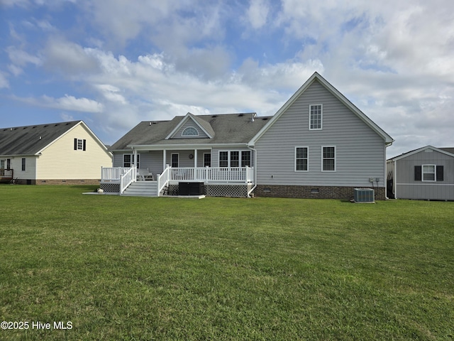 back of property featuring a shed, a wooden deck, a yard, and central AC