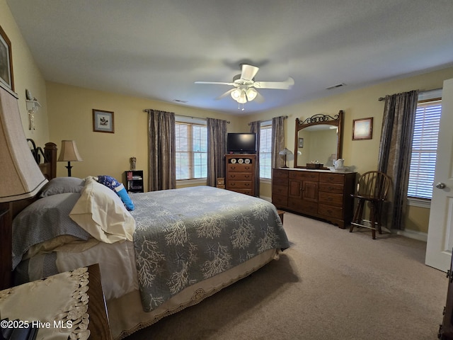 carpeted bedroom featuring ceiling fan