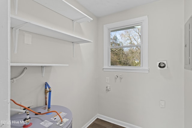 laundry area with laundry area, baseboards, and hookup for an electric dryer