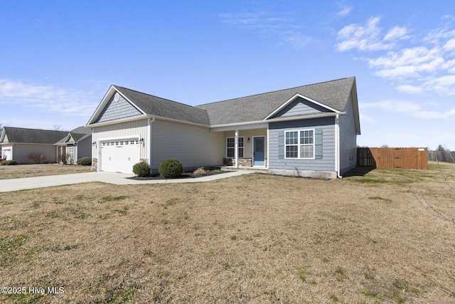 ranch-style house with a garage, concrete driveway, a front yard, and fence