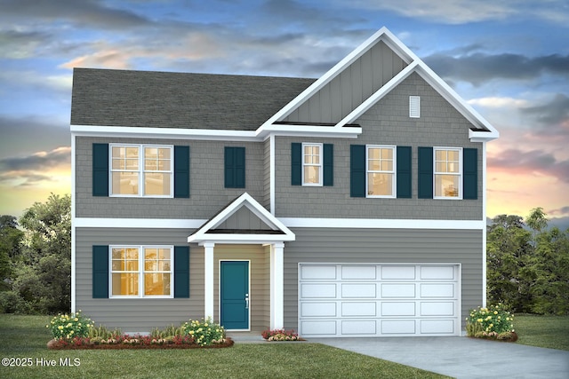 craftsman house featuring a garage and a yard