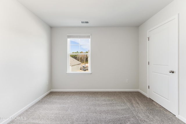 spare room featuring carpet flooring