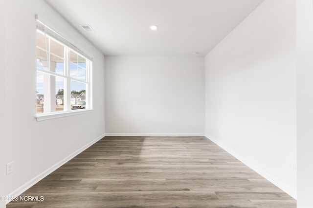 empty room with light hardwood / wood-style floors