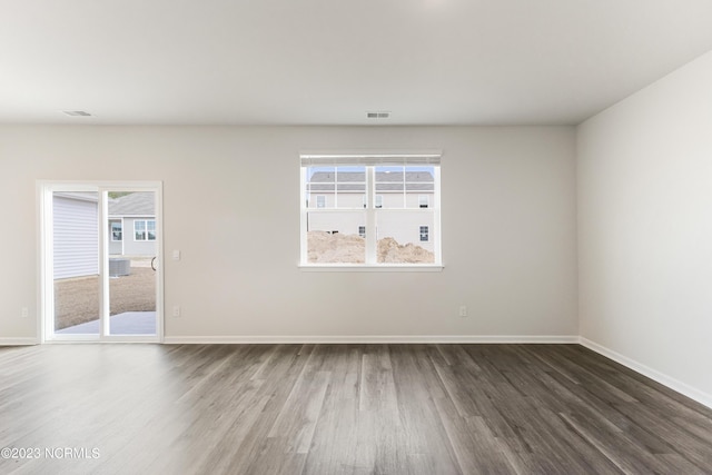 empty room featuring dark wood-type flooring